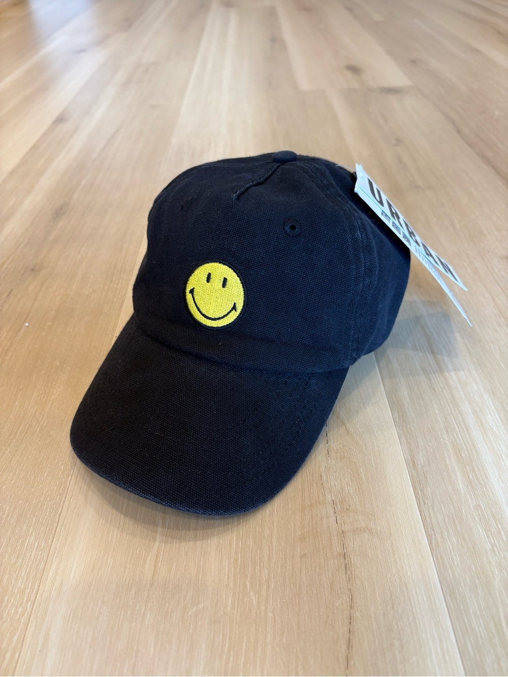 Urban Outfitters Black Baseball Cap with Yellow Smiley Patch